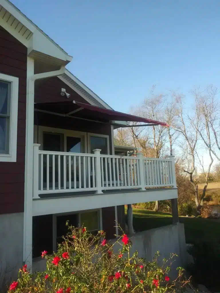 kccs 2nd floor deck with red awning and white railing