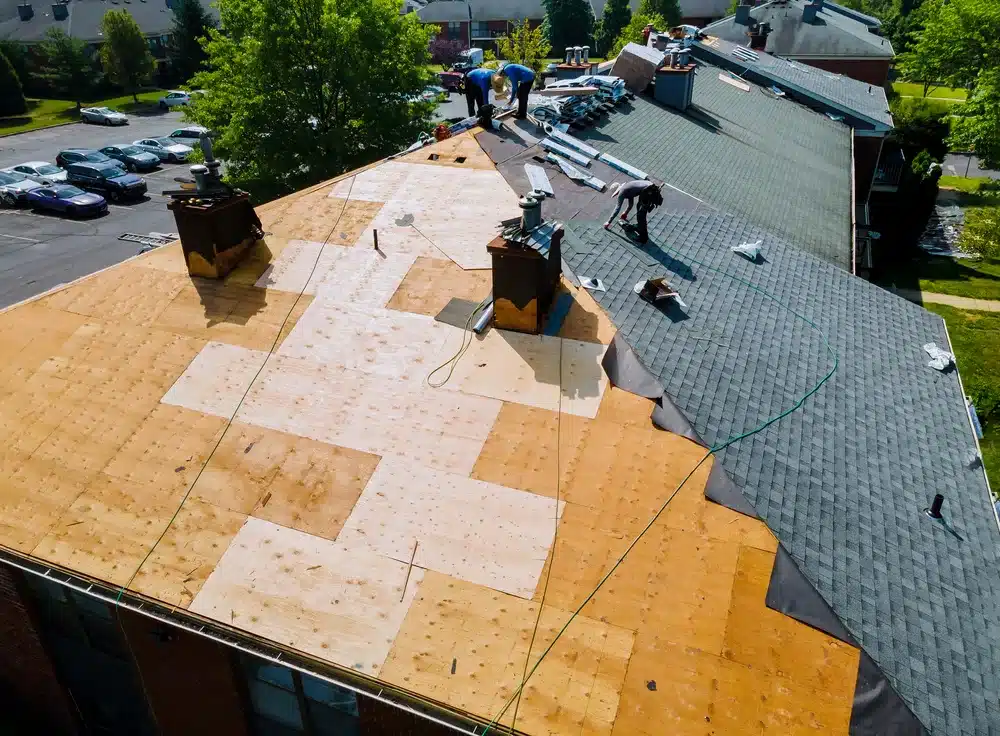 crew fixing a roof