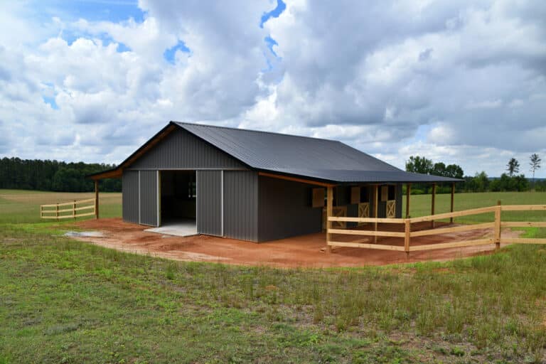 Horse barn built with post frame materials; two lean-to's, two sliding barn doors, six stalls, concrete floor